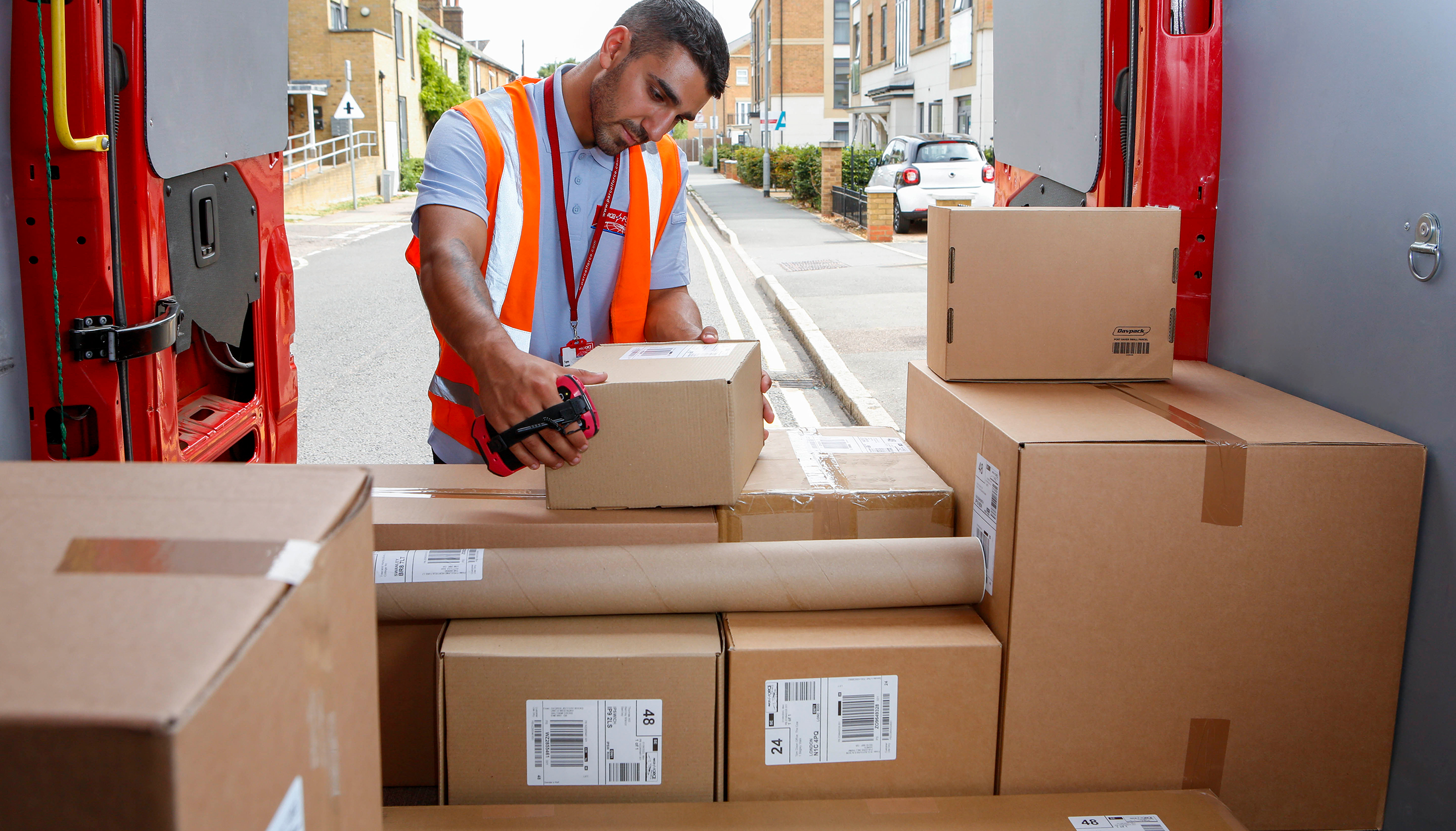 Postie arranging parcels